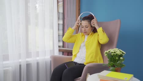 Unhappy-woman-listening-to-music-with-headphones.